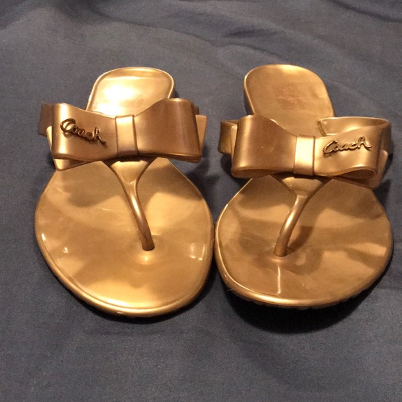 coach gold flip flops